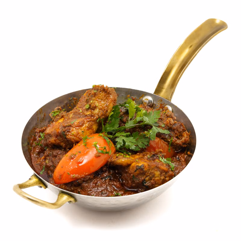 Chicken karahi garnished with fresh coriander